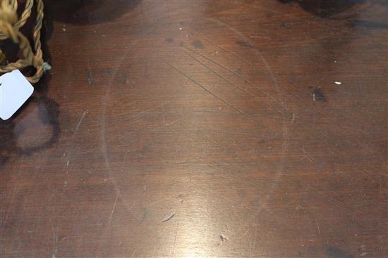 A George III mahogany double gateleg table opens to 2ft 4in. x 4ft 11in.